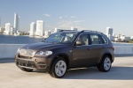 2013 BMW X5 xDrive50i in Sparkling Bronze Metallic - Driving Front Left Three-quarter View